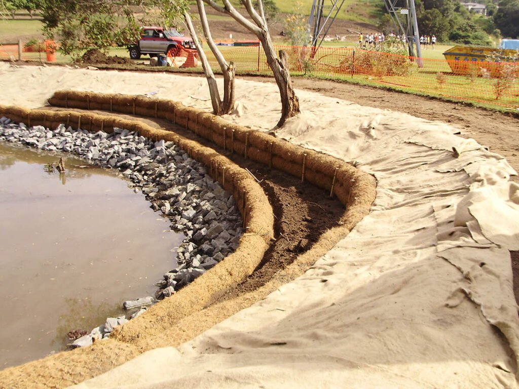 Coir Logs Lining a Pond Bank